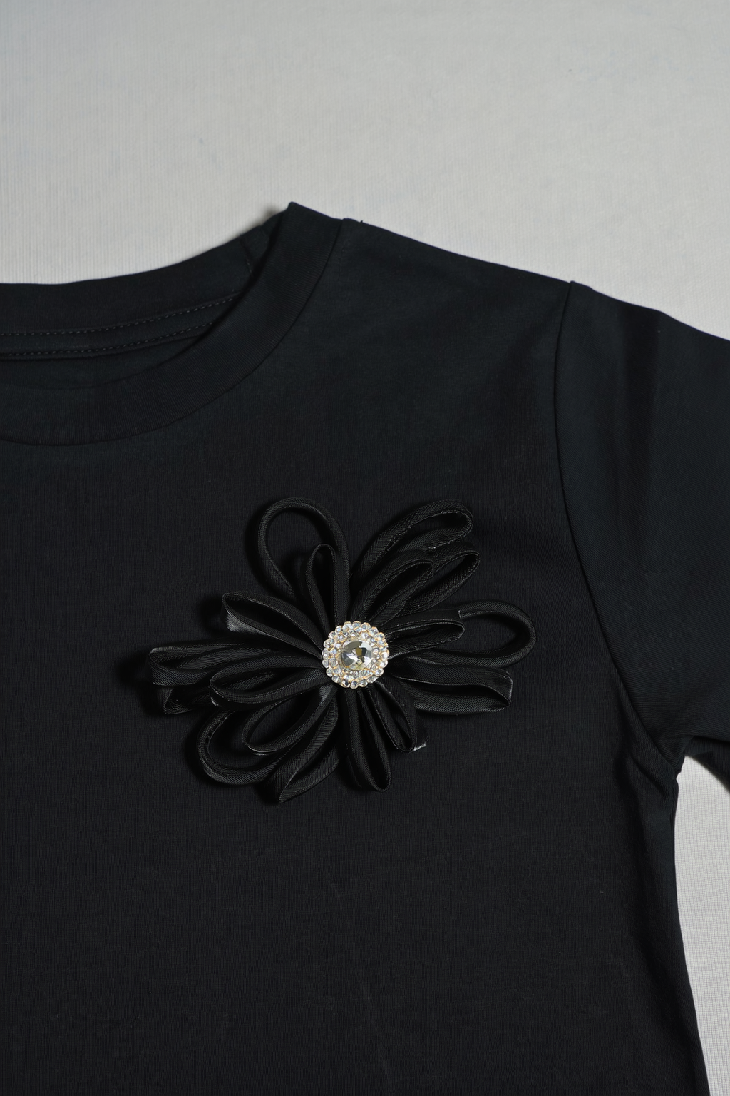 Black T-Shirt with Rhinestone Flower Detail