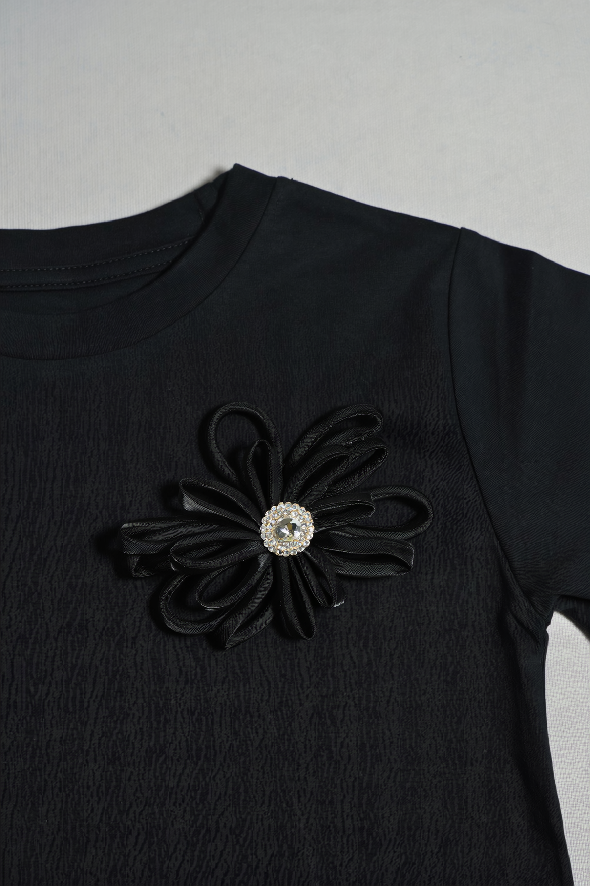 Black T-Shirt with Rhinestone Flower Detail