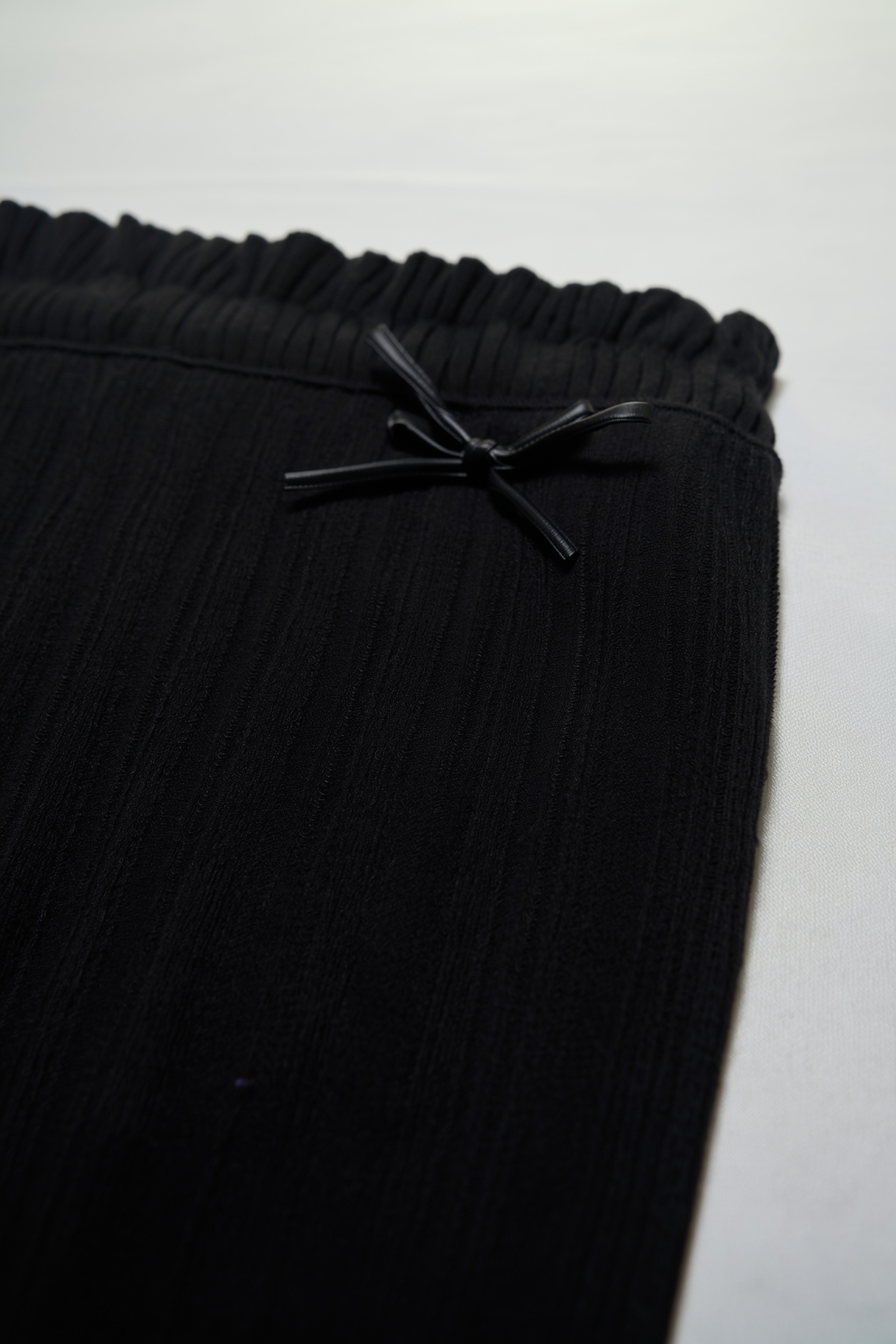 Black flared leggings with ruffles